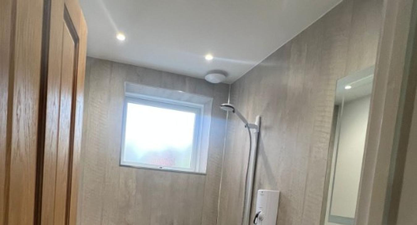 Electric shower installation Ledbury: do I need an electrician or a plumber?